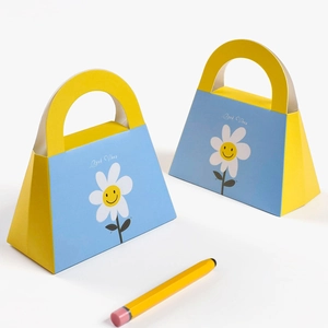 Trapezoidal wedding favor bag with yellow and blue daisy print and Good Vibes text