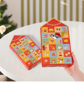 Detail of red 24-grid advent calendar house with festive illustrations and tiny surprise toys