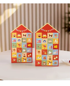 Detail of red festive advent calendar box with 24 small perforated window slots