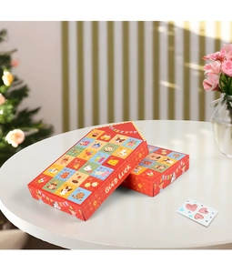 Detail of red 24-grid New Year advent calendar box with festive cartoon illustrations