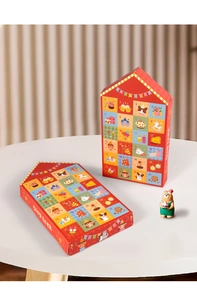 Close-up of 24-day Christmas advent calendar gift boxes with festive house-shaped design