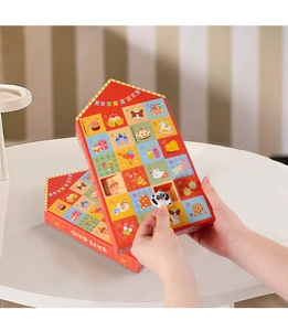 Detail of red 24-grid advent calendar box showing small Panda eraser from numbered slot