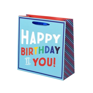 Blue Happy Birthday paper gift bag with colorful lettering and blue ribbon handles