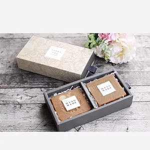Rectangular pull-out gift box with handmade soap and floral packaging on wood