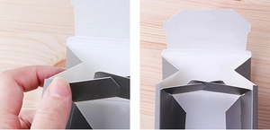 Macro view showing the folding slot and assembly detail of the square paper gift box