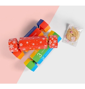 Detail of candy-shaped paper gift boxes with snowflake and colorful number prints