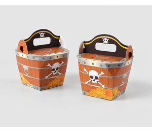 Detail of pirate party favor boxes with wood grain texture and skull coin patterns