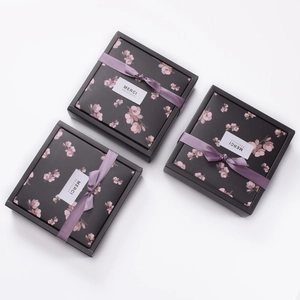 Square premium gift boxes with cherry blossom patterns and purple ribbon bows