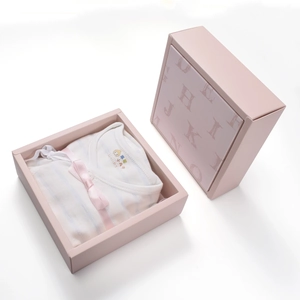 Baby onesie with blue stripes and pink bow in an elegant embossed pink gift box