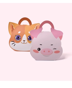 Close-up of cute cat and pink pig cardboard gift boxes with portable handles