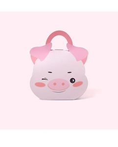 Close-up of a pink pig shaped paper gift bag with cute cartoon ears and handle