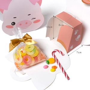Pink pig themed gift box for candies with dimensions 10x8x7cm and golden ribbon decoration