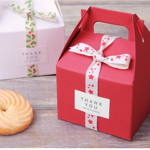 Square Thank You stickers on red and white gift boxes with cotton ribbons for packaging