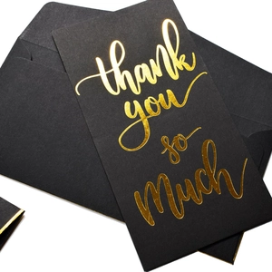 Premium black thank you card with gold foil lettering and matching luxury envelope