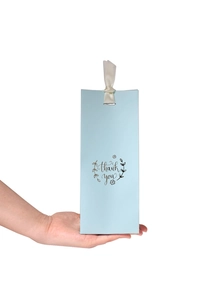 Light blue gift bag with white satin ribbon handle and 'thank you' printed design
