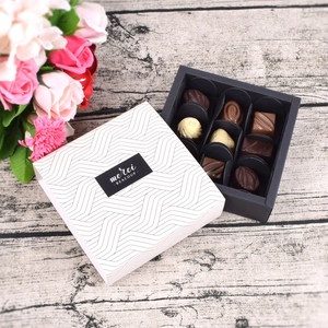 Elegant 9-piece chocolate gift box with white geometric pattern and pull-out design