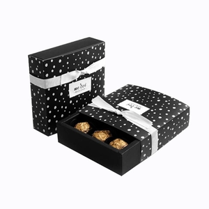 Polka dot drawer gift box set with white ribbon and Merci Beaucoup label for chocolate