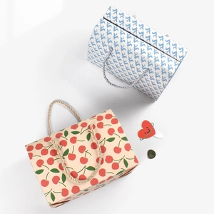 Minimalist rectangular gift boxes with cherry and geometric patterns and woven handles