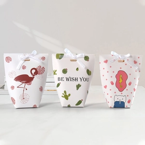 Three assorted folding gift boxes with ribbon bows for candies or small favors