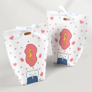 Polka dot paper gift bags with seahorse and elephant prints and white ribbons