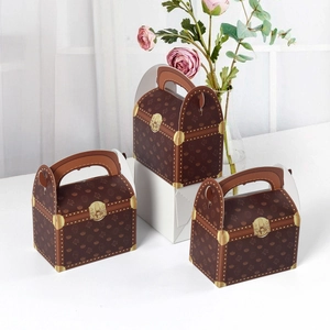 Retro suitcase-style gift box in dark brown with elegant patterns and arch handle