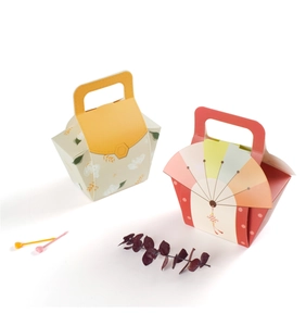 Detail of floral and Chinese style gift boxes with integrated handles for pastries