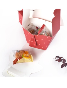 Detail of red polka dot portable paper food box with mango lava mooncake packaging