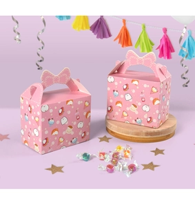 Close-up of pink Halloween candy boxes with cartoon cat patterns and bow handles