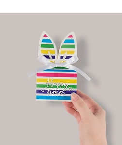 Detailed shot of rainbow striped rabbit ear candy box with white satin ribbon bow