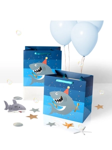 Blue shark birthday gift bags with happy birthday text and a plush toy shark keychain