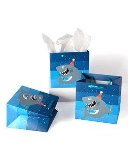 Shark theme party gift bags with blue stripes and silk handles in various display states