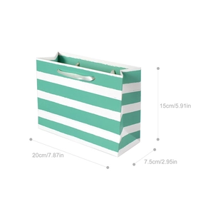 Detailed view of green striped gift bag dimensions 20x15x7.5 cm with ribbon handle