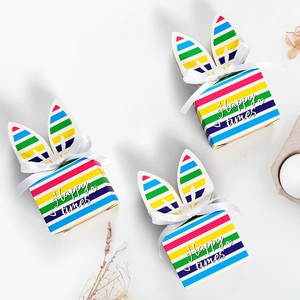 Rainbow striped rabbit ear gift boxes with white bows for candy and party favors