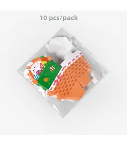 Flat lay of 10-piece pack of Easter gift boxes featuring cartoon rabbits and egg prints