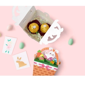 Detail of Easter candy boxes with hollow white design and cartoon bunny gift baskets