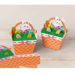 Detail of unfolded and assembled orange Easter gift boxes with cute rabbit cutouts