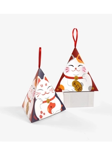Detailed view of pyramid gift boxes featuring traditional lucky cat design and red ribbons