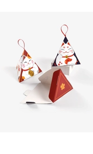 Detailed view of Maneki Neko triangular gift boxes with red ribbons and flat template