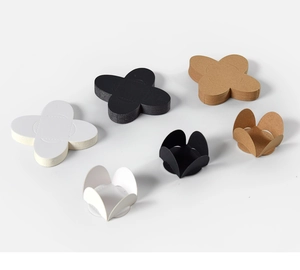 Three-color petal shaped paper chocolate trays in flat and folded 3D arrangements