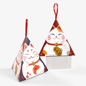 Pyramid-shaped gift boxes featuring Lucky Cat designs with red ribbon handles and gold motifs