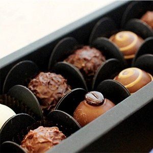 Exquisite Valentine chocolate gift box with assorted truffles in black paper trays