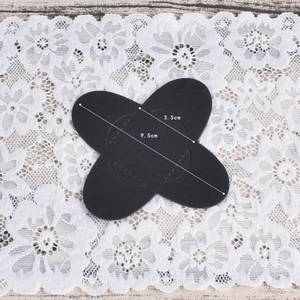 Set of black oval fabric patches for elbow or knee repair with 9.5cm and 3.5cm dimensions