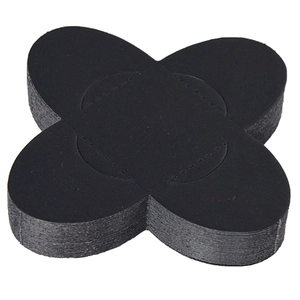 Stack of black cross-shaped disposable nipple covers with breathable non-woven texture