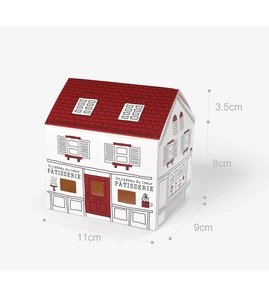 Close-up of white paper house gift box with red roof and artistic hand-drawn illustrations