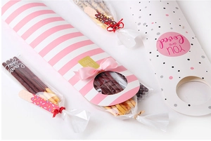 Pink striped and polka dot snack gift boxes with ribbons and for you tags