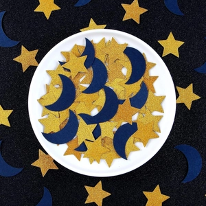 Star and moon confetti in gold glitter and deep blue for festive party table decor