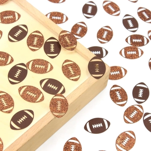Close-up of glittery brown American football paper confetti for party table decoration