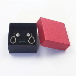 Detail of a luxury jewelry set with blue rhinestone ring and earrings in a gift box