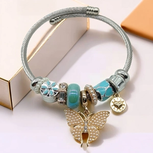 Pandora style gold and silver charm bracelet with pearl butterfly pendant and enamel beads