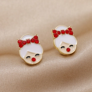 Boucles d'oreilles fille en alliage avec strass rouges sur fond de satin champagne